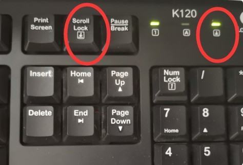 键盘右上角的来自第三个灯怎么关掉？
